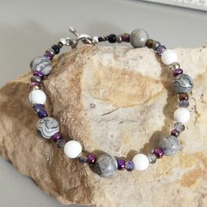 Almost planetary grey, purple and white bracelet